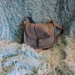 Small green saddle style handbag